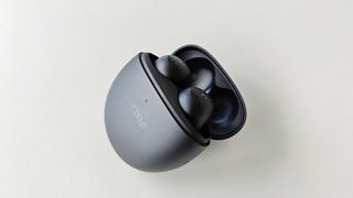 1More Comfobuds Mini review: earbuds in a matching charging case