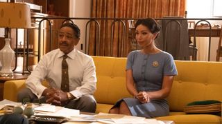 Giancarlo Esposito and Ilfenesh Hadera as Adam Clayton Powell and Mayme Johnson sitting on a couch in Godfather of Harlem season 3