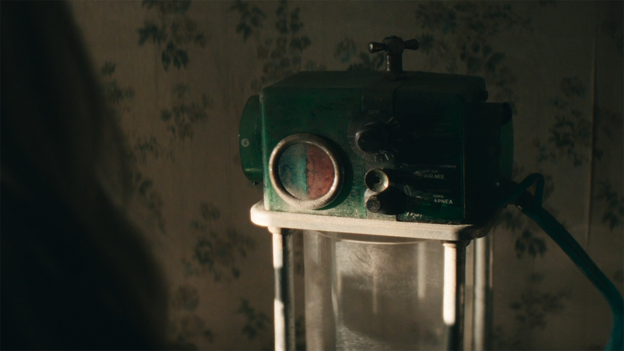 A close-up of Harmony Cobel's mom's ventilator in Severance season 2 episode 8