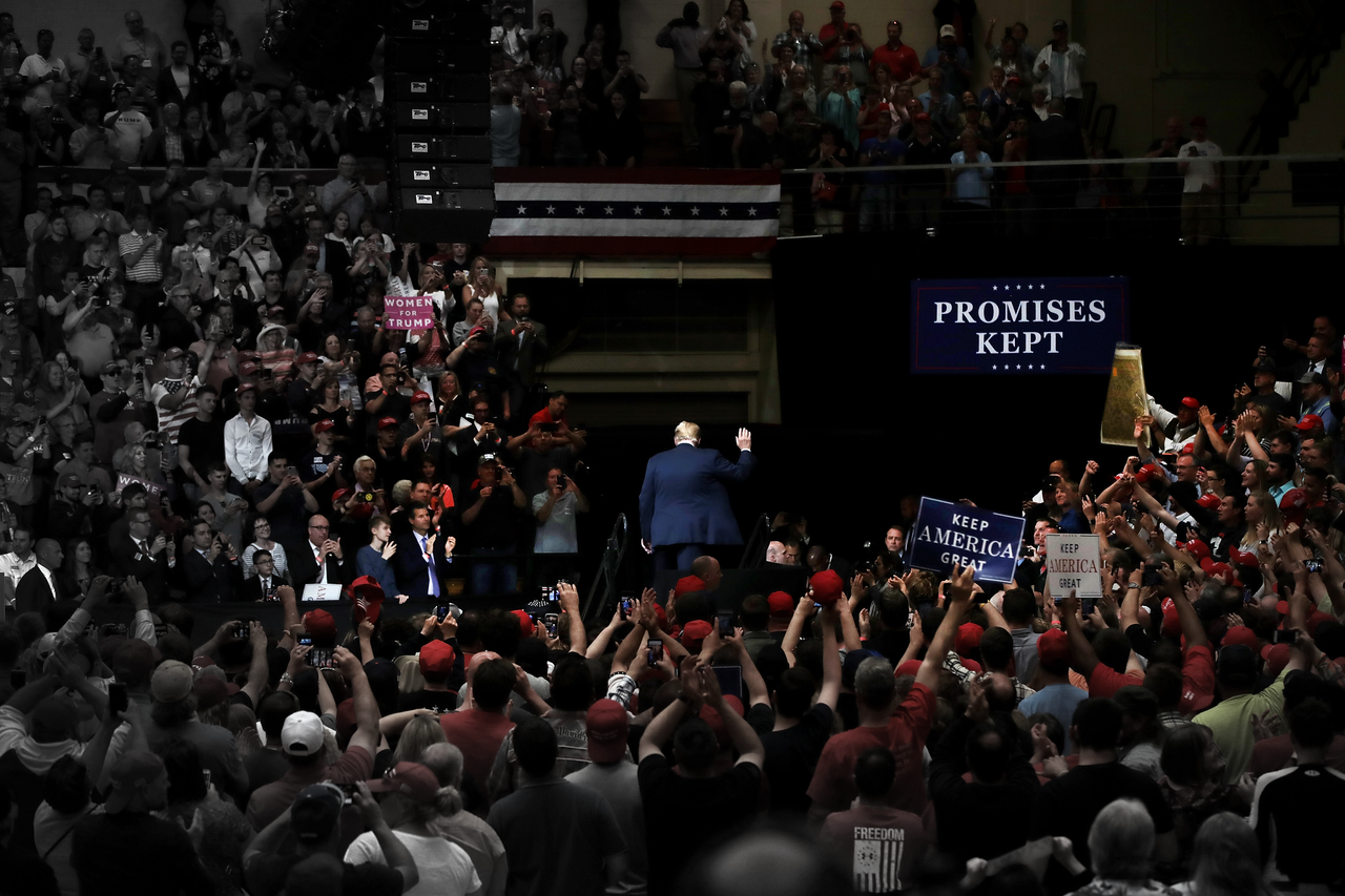 President Donald Trump leaves a rally. 