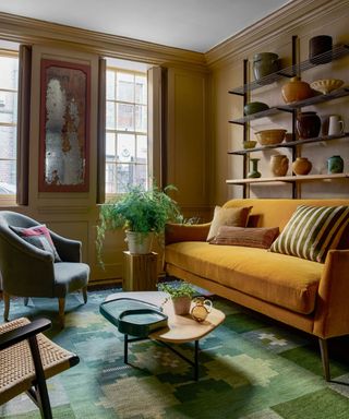 Green and yellow living room, bright yellow sofa, green rug