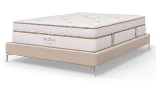 Saatva mattress sales, deals and discount codes: the Saatva Latex Hybrid Mattress on a beige faux leather bed base