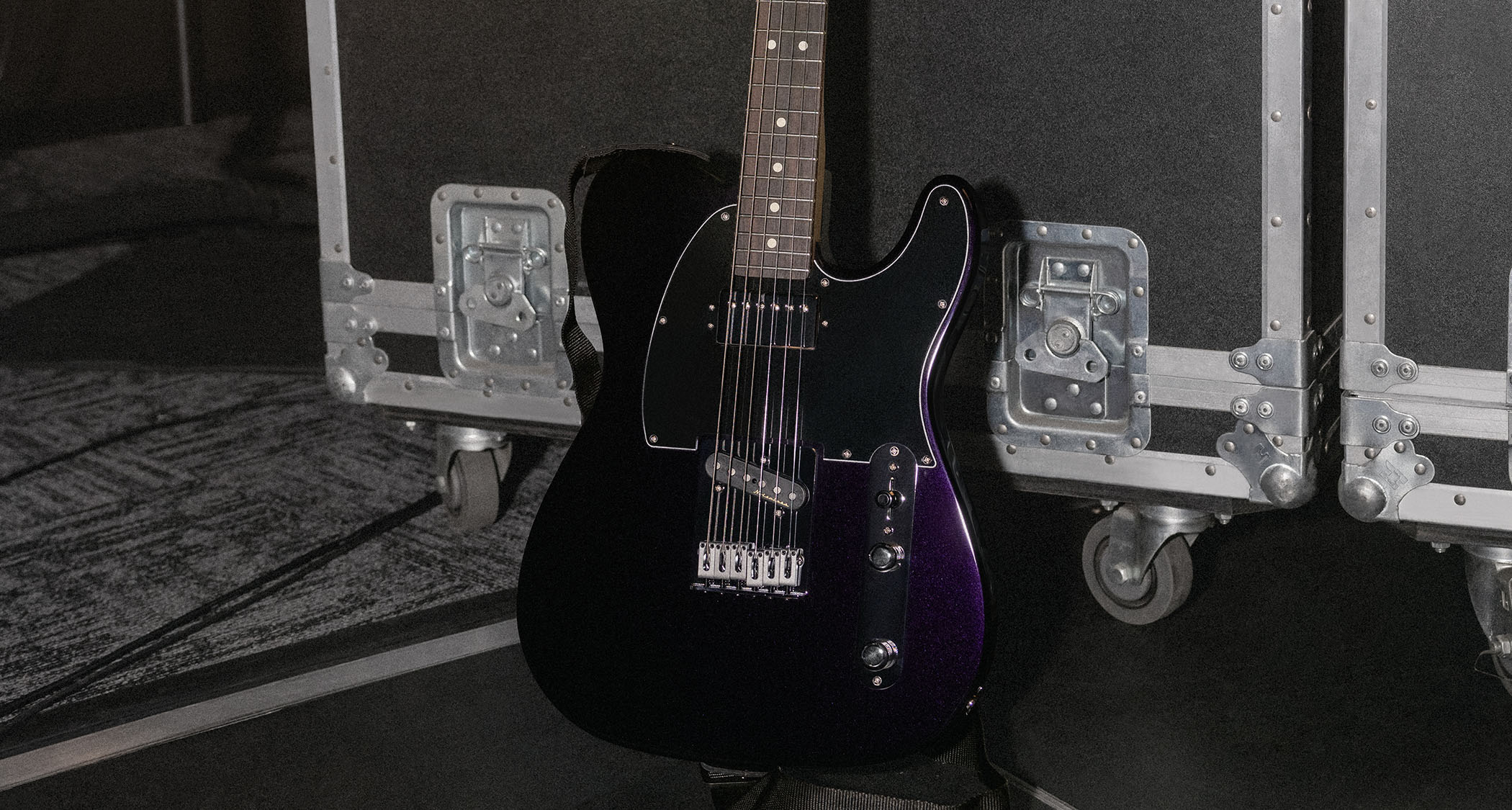 Fender Player II Modified Telecaster SH: the factory-modded, humbucker-equipped Telecaster is finished in Dusk, a dark metallic purple, and is photographed backstage.