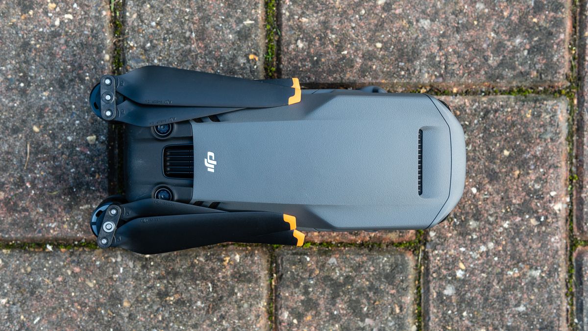 A folded DJI Mavic 3 drone resting on a patio