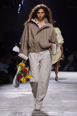 a Bottega Veneta model walks the spring/summer 2025 runway