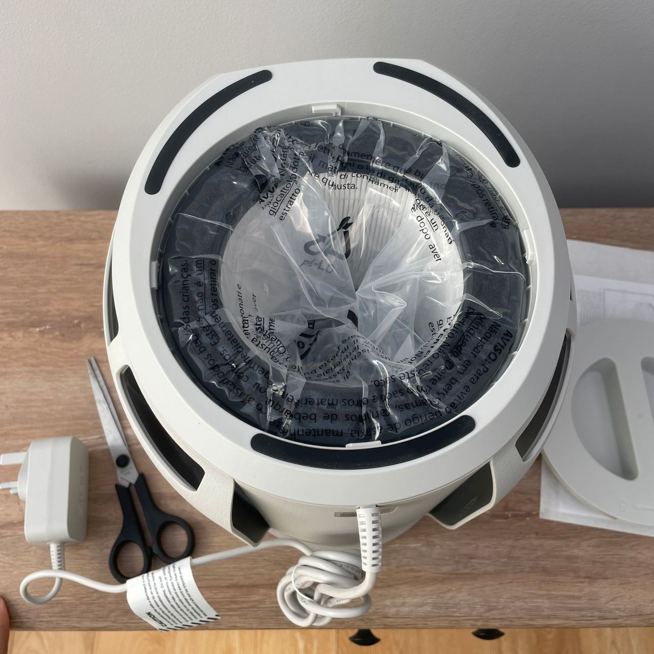 Underside of the Shark BreatheClear Compact Air Purifier with NeverChange6, showing the filter wrapped in plastic