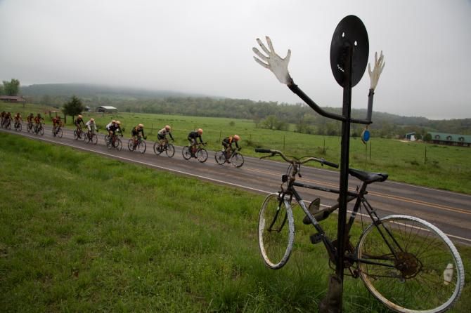 The pro men's peloton is welcomed by some Arkansas farm art.