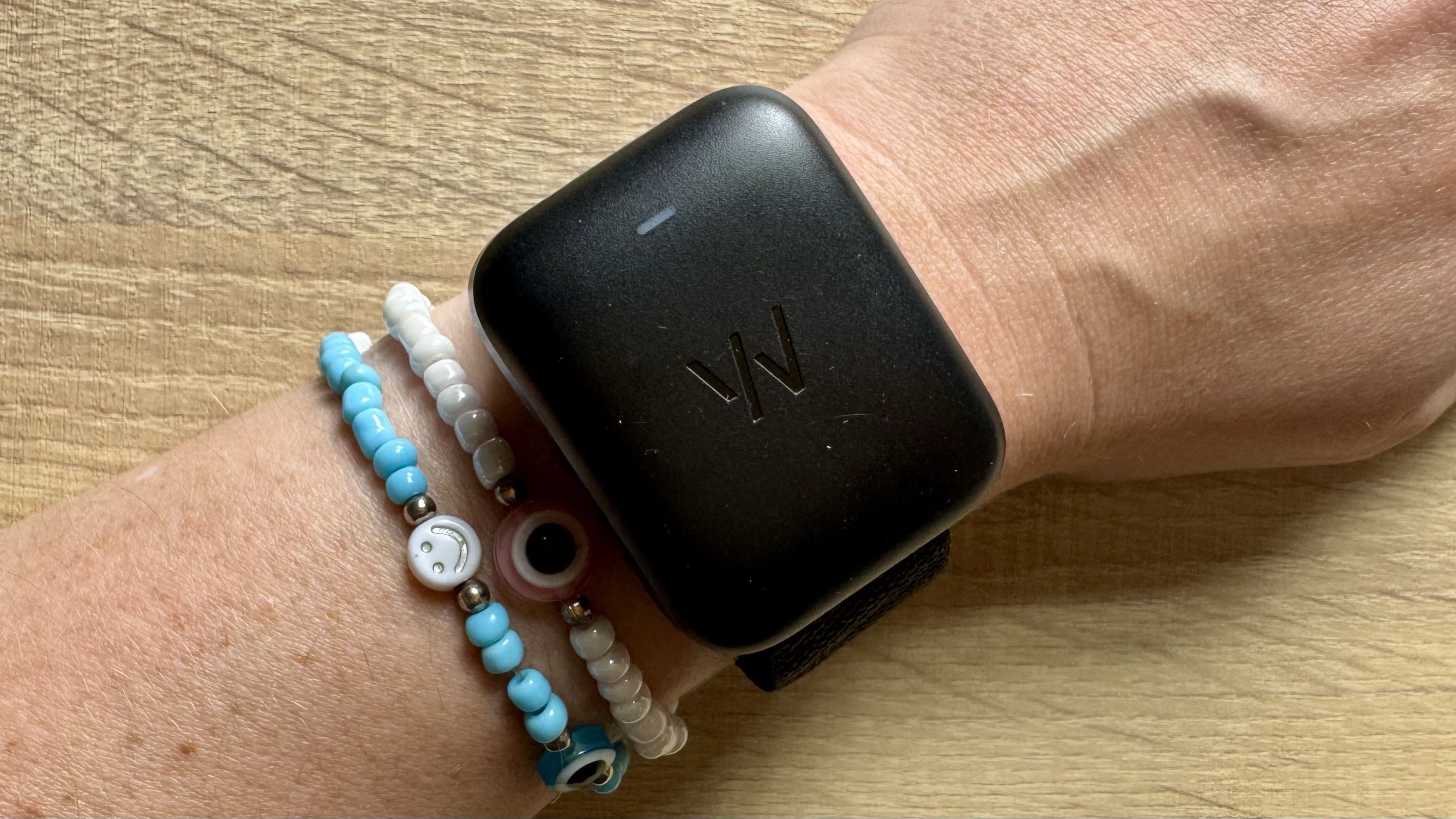 a photo of the Whoop MG with wireless charger