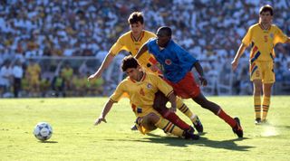 18 June 1994, Fifa World Cup, Colombia v Romania, Miodrag Belodedici of Romania tackles Faustino Asprilla of Colombia. (Photo by Mark Leech/Getty Images)