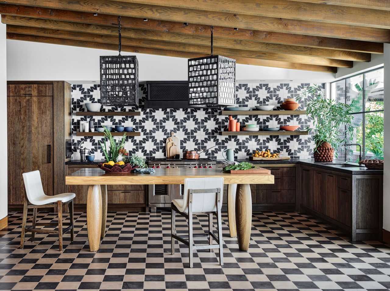 a modern kitchen with black and white geometric patterns on the wall and checkerboard tile flooring with surrounding wood accents