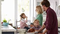 A happy family in the kitchen.