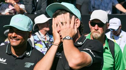 Joaquin Niemann puts both hands over his face in the aftermath of winning LIV Golf Adelaide 2025