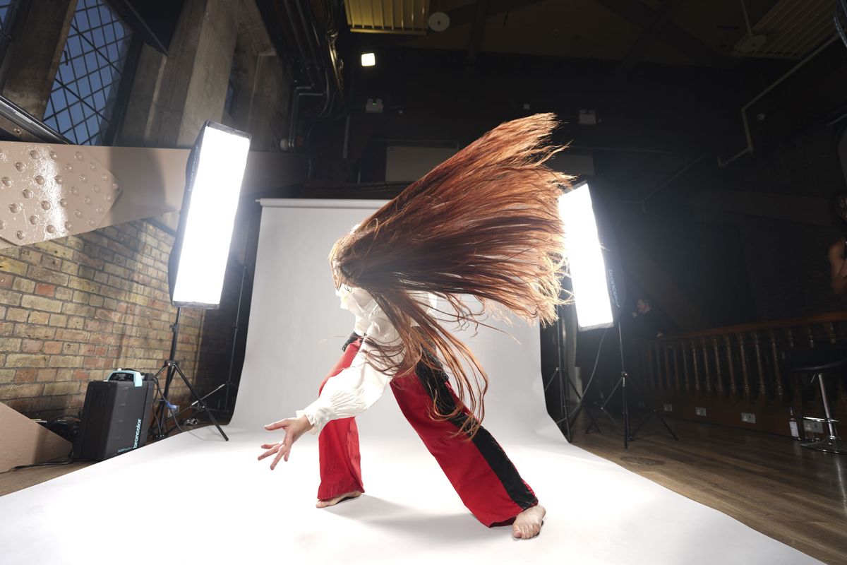 Sony A7 V sample images &ndash; dancer's movement frozen, with background roll and lights included in the frame