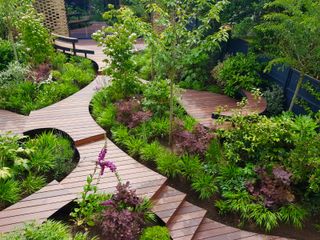 Japanese garden ideas with curved timber pathways and decked terraces
