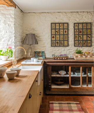 Cotswold kitchen belonging to Lisa Mehydene with cabinets by Plain English, photogrpah Belle Daughtry