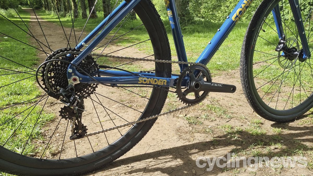 A close up of the drivetrain on a blue Sonder Camino gravel bike