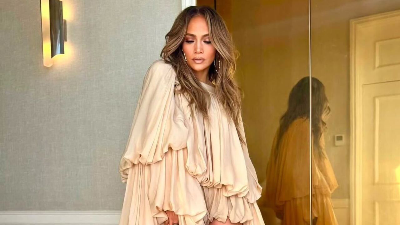 Jennifer Lopez wearing a chloe onesie with floor length sleeves