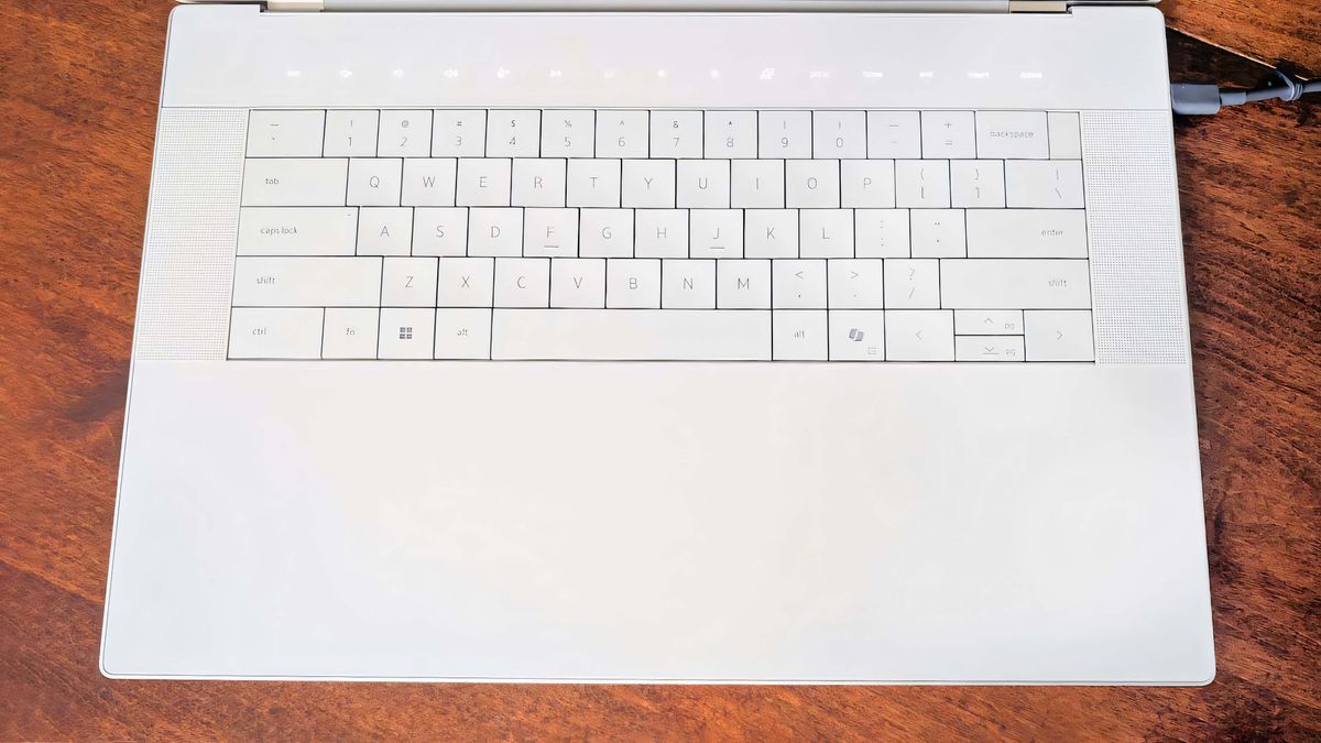A shot that focuses on the Dell 16 Premium keyboard and invisible touchpad.
