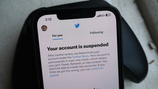 A "Your account is suspended" message in the Twitter app