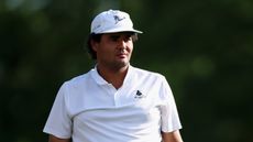 Eugenio Chacarra wearing a white polo and white cap