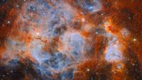 A swirling deep space nebula vista reveals pockets of pale blue glowing gas surrounded by reddish-orange clouds peppered with stars.