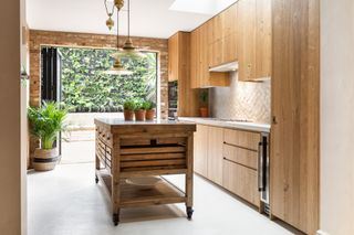Moveable island on wheels in a wood kitchen