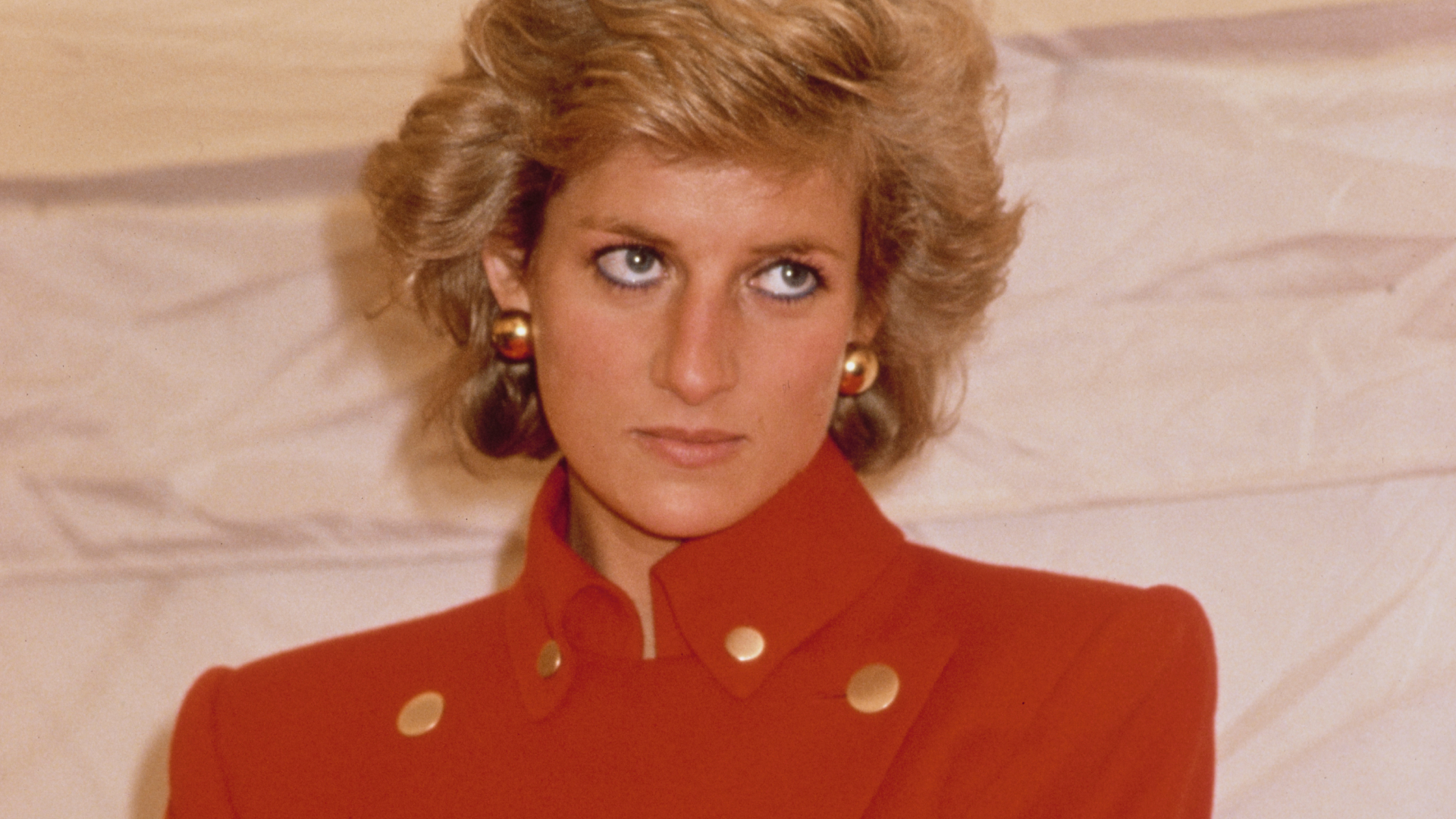 Diana, Princess of Wales (1961 - 1997) wearing a red suit by Catherine Walker during a visit to Pudsey in West Yorkshire, UK, July 1989