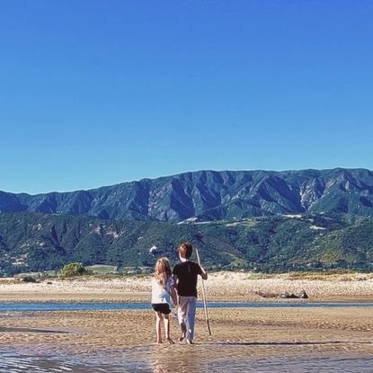 Prince Archie and Princess Lilibet on a beach
