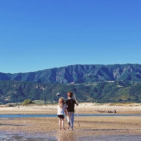 Prince Archie and Princess Lilibet on a beach