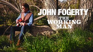John Fogerty sitting on a tree stump with a Rickenbacker guitar