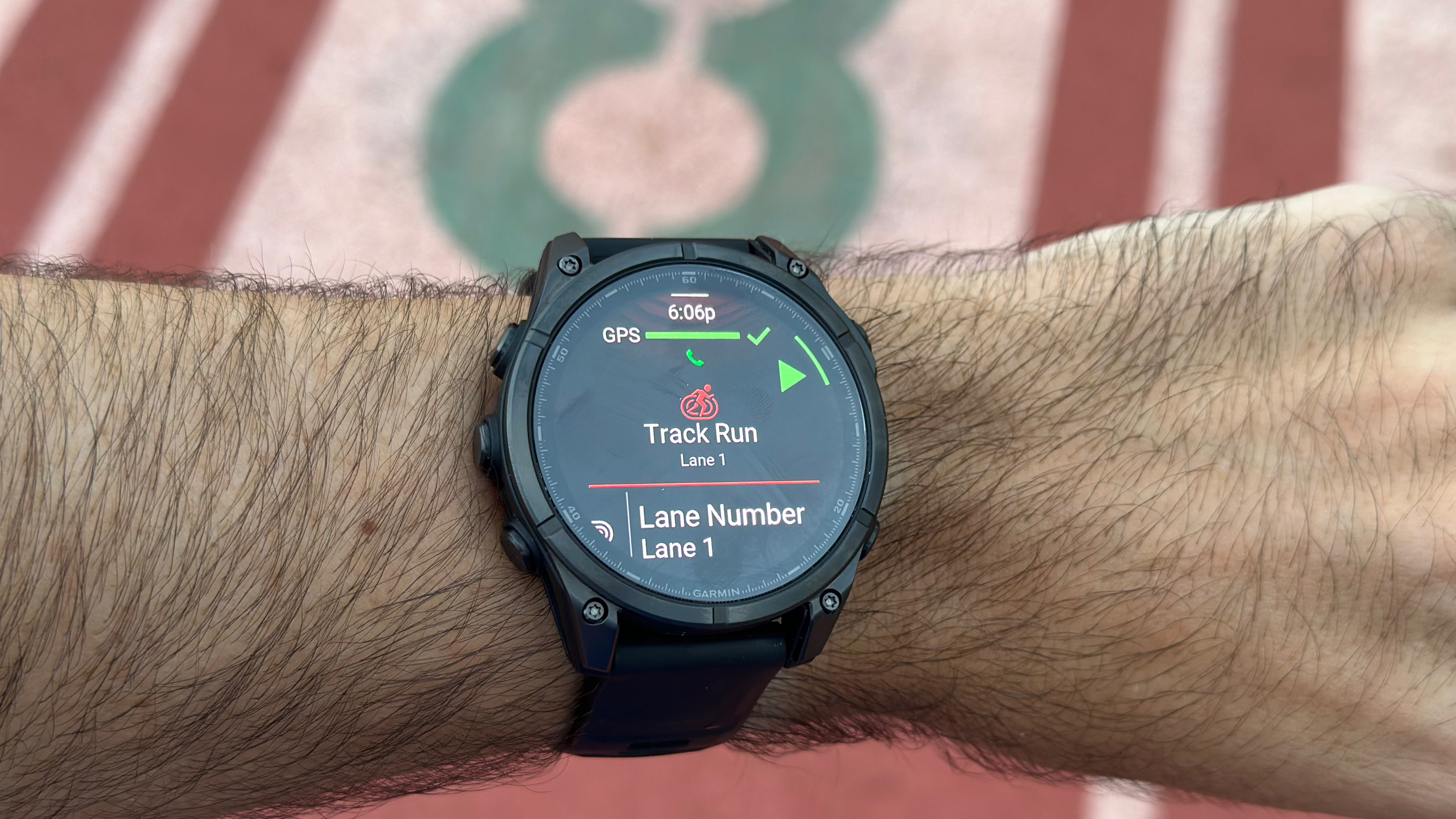 Starting a new track run activity on the Garmin Fenix 8. It now shows the settings and courses directly underneath the activity instead of hiding them in menus.