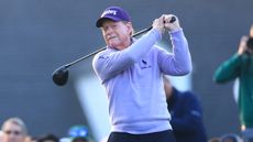 Tom Watson tees off on the first hole at Augusta National 