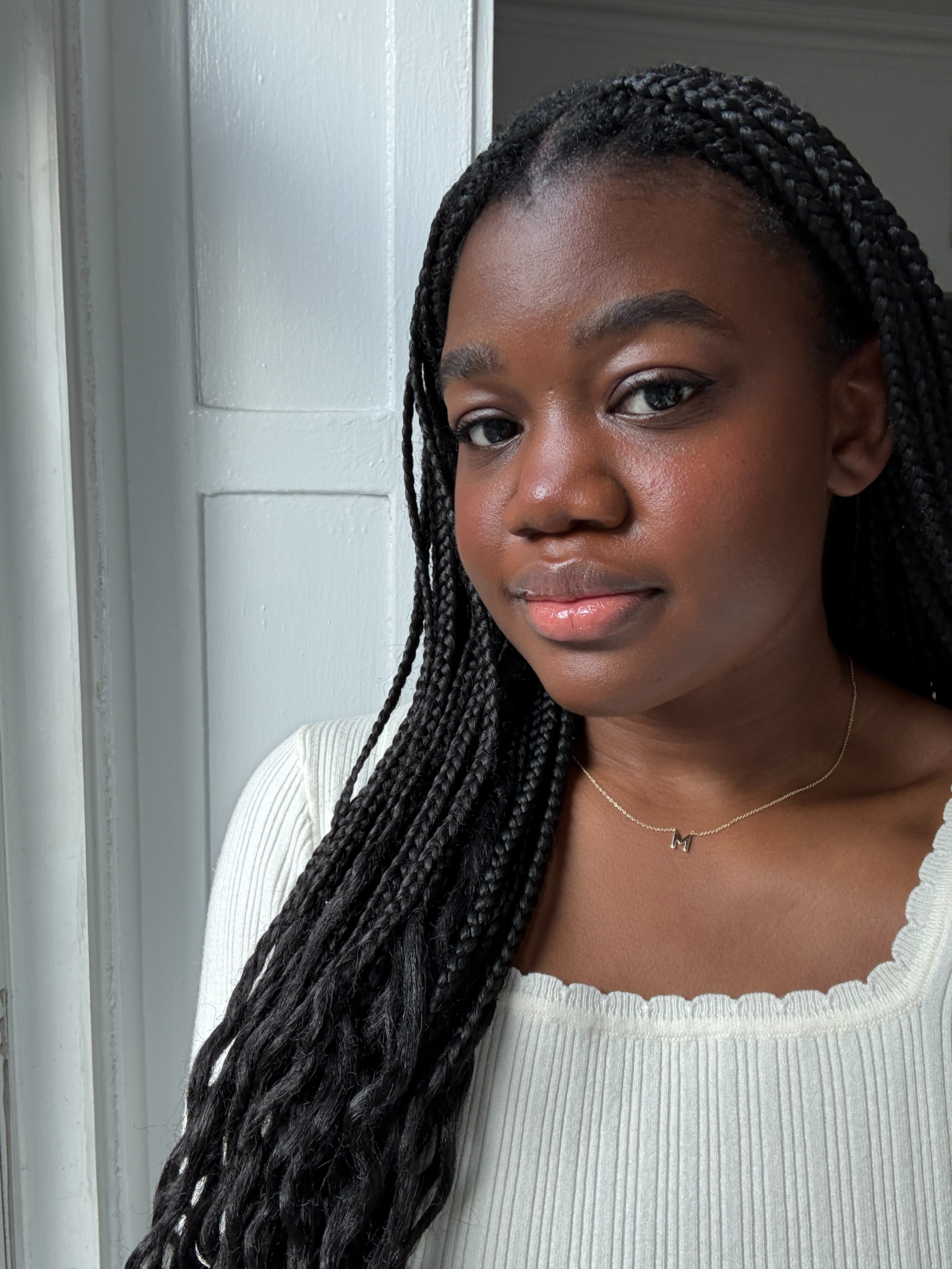 Associate Beauty Editor Maya Thomas wearing Good Weather Skin's The One Daily Sun Cream SPF 30 Mineral Sunscreen