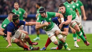 Caelan Doris of Ireland, supported by Joe McCarthy, is tackled by Gregory Alldritt, left, and Paul Willemse of France
