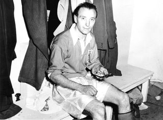 Blackpool footballer Stanley Matthews shows his winners medal after the victory over Bolton Wanderers in the FA Cup Final at Wembley. 2nd May 1953.