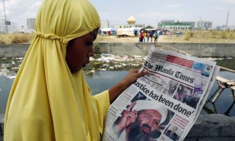 A Muslim woman reads about Osama bin Laden&amp;#039;s demise: The daring nighttime U.S. military raid that killed the terrorist mastermind was several months in the making.