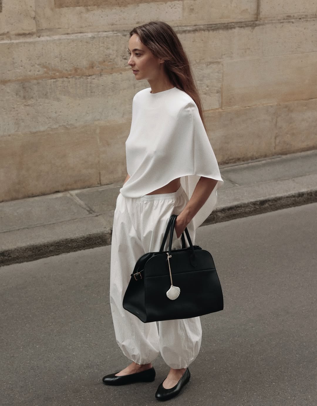 Annemiek Kessels wears a cape blouse