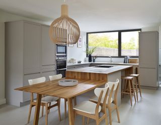 a kitchen island idea with an integrated dining table