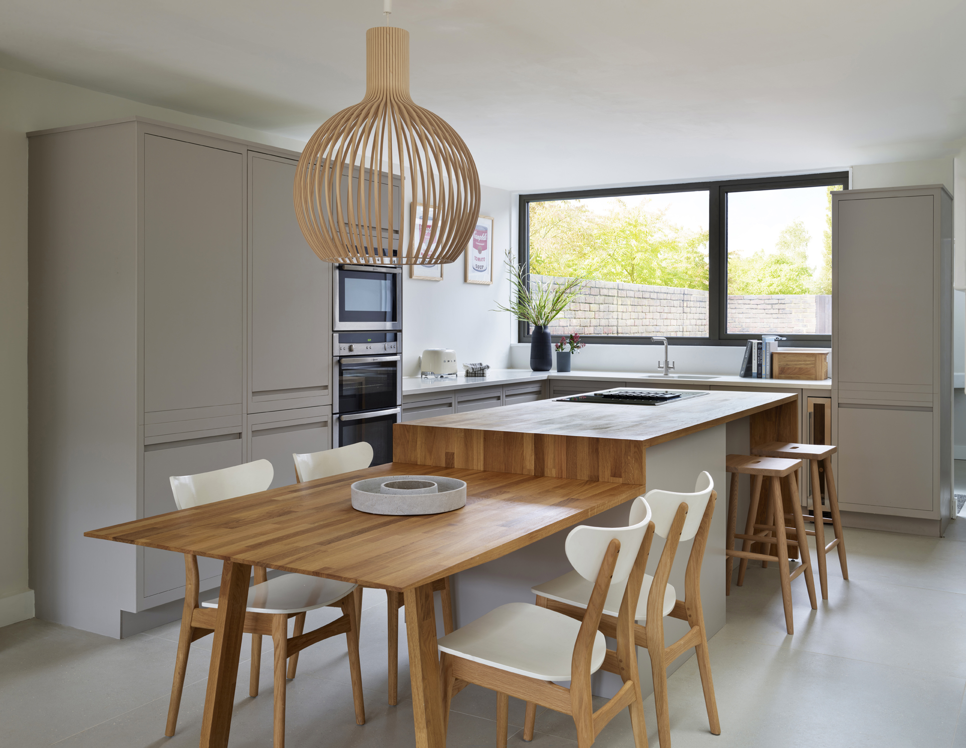 a kitchen island idea with an integrated dining table