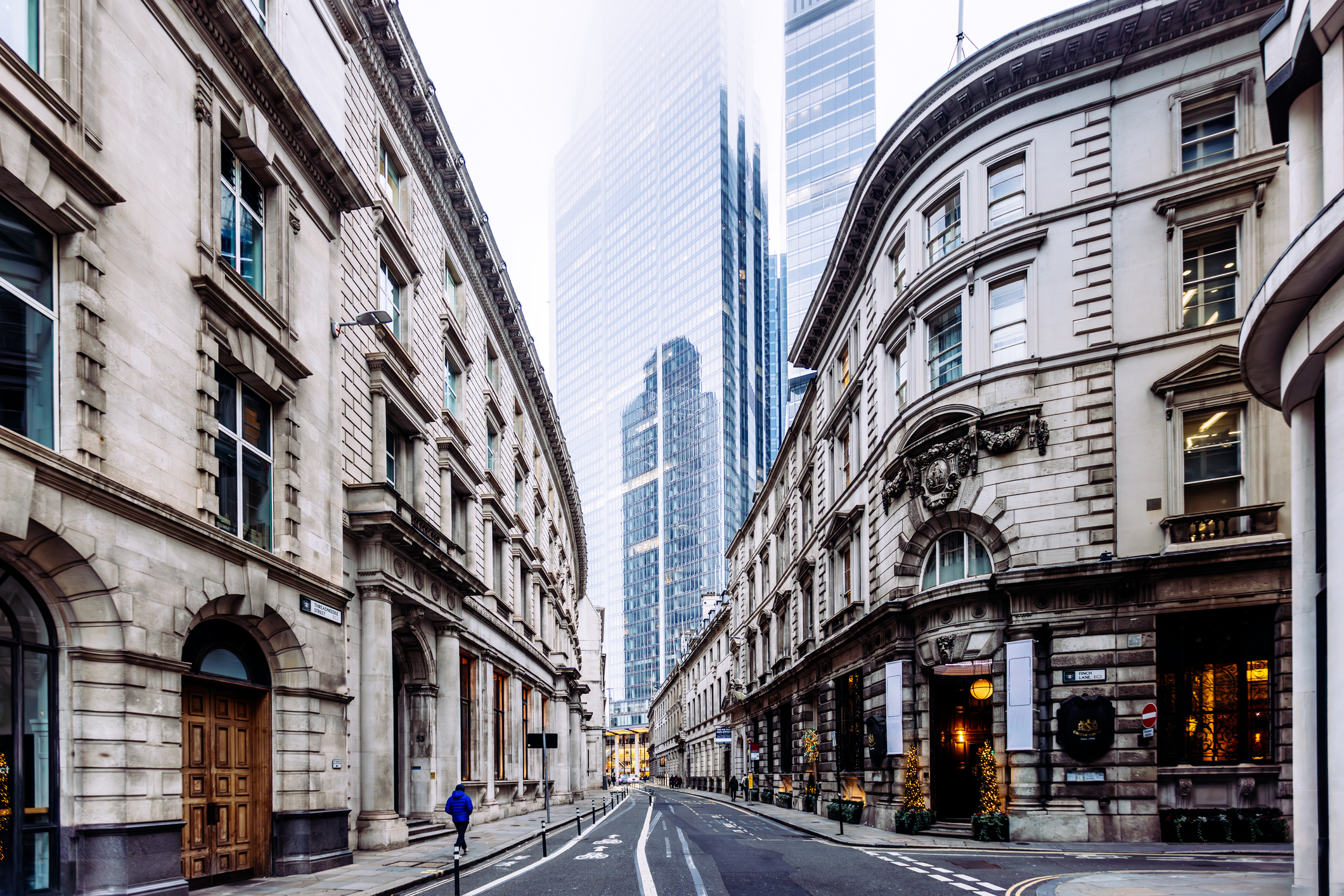 Street with historic buildings and new skyscrapers in City of London
