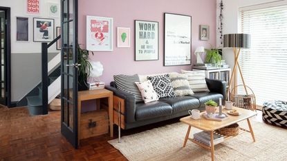 living room with pink wall and side table 