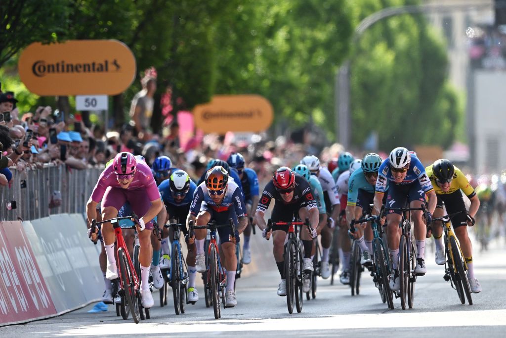 LUCCA ITALY MAY 08 LR Jonathan Milan of Italy and Team Lidl Trek Purple Points Jersey Caleb Ewan of Australia and Team Jayco AlUla Alberto Dainese of Italy and Tudor Pro Cycling Team and Tim Merlier of Belgium and Team Soudal QuickStep sprint at finish line during the 107th Giro dItalia 2024 Stage 5 a 178km stage from Genova to Lucca UCIWT on May 08 2024 in Lucca Italy Photo by Tim de WaeleGetty Images