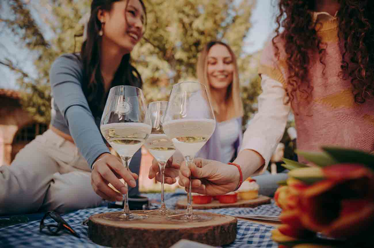 Friends enjoying Asti sparkling wine