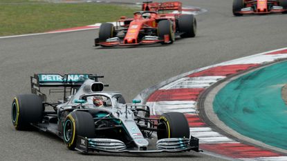 Mercedes driver Lewis Hamilton races against the Ferraris at the 2019 Chinese Grand Prix