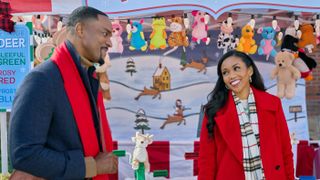Ronnie Rowe, Mishael Morgan at a holiday carnival in Christmas with a Kiss
