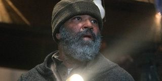 Jeffrey Wright holding a flashlight Russell Core Hold the Dark