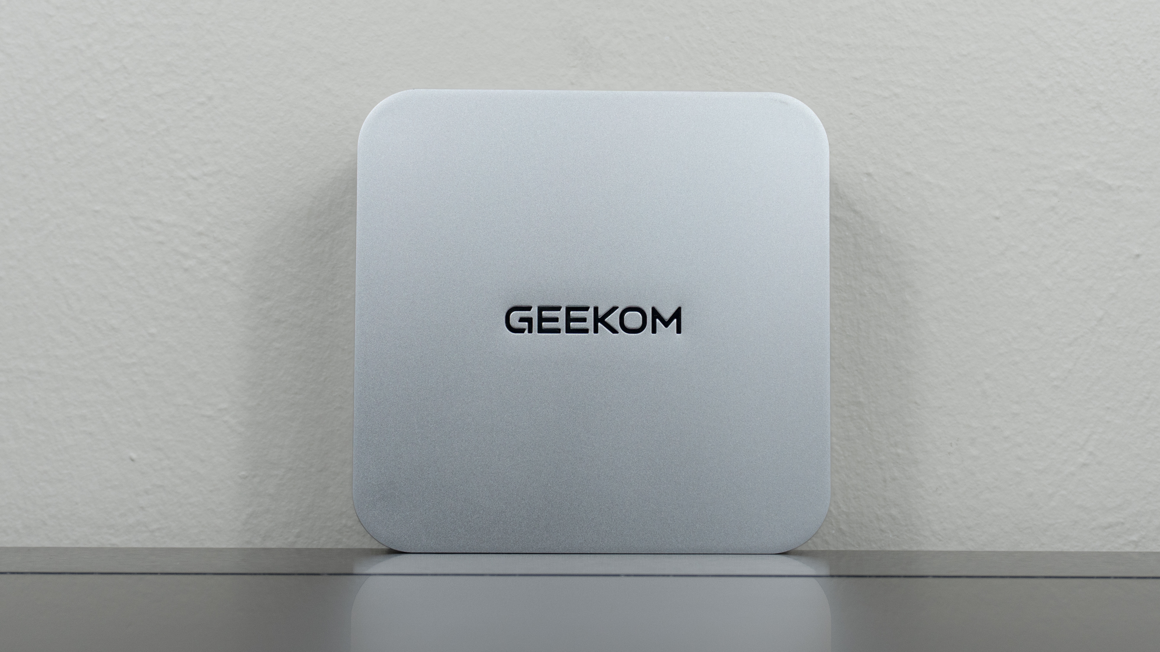The Geekom A9 Max 2026 Edition upright on a desk