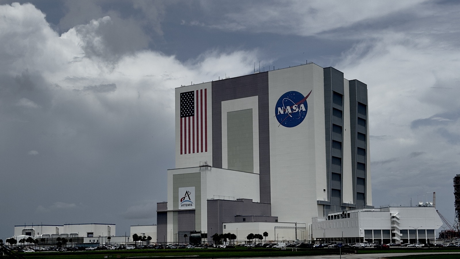 A white building in front of a cloudy sky