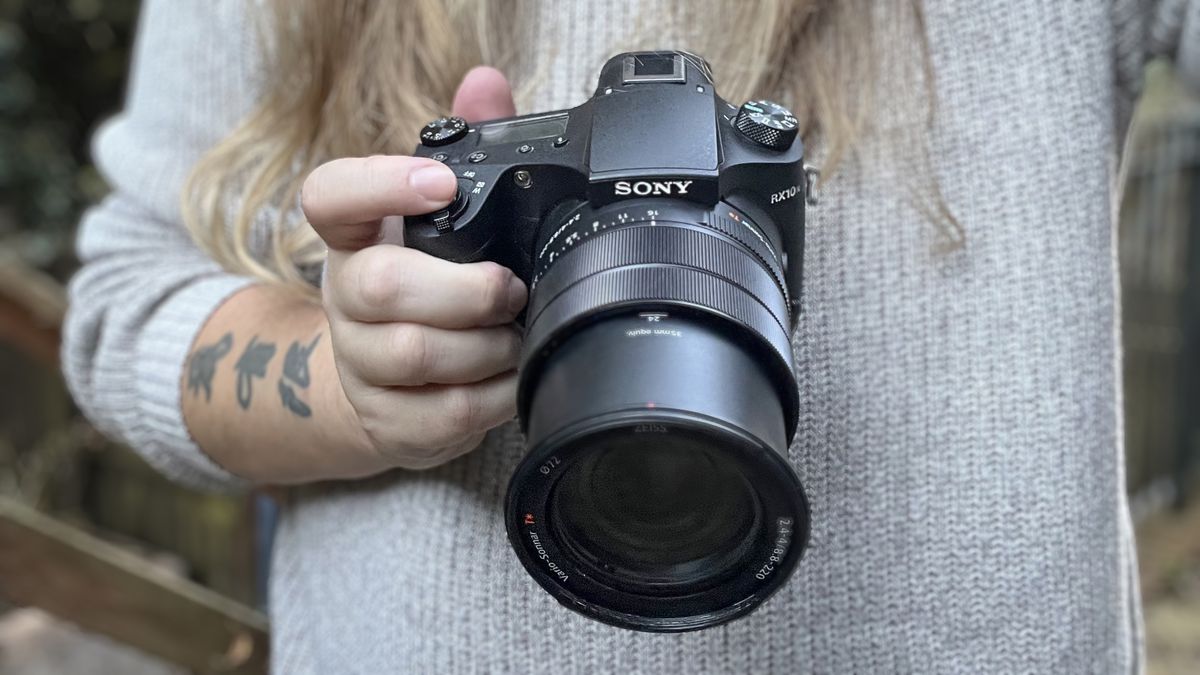 Sony RX10 IV being held by reviewer James Artaius, outdoors