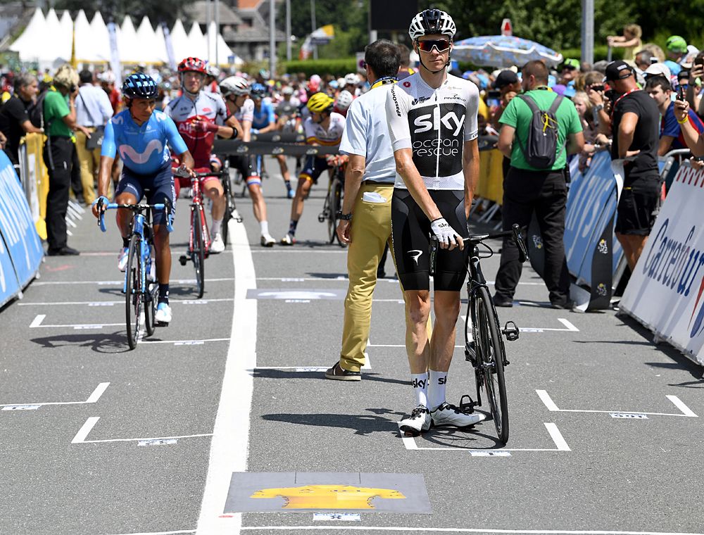 Chris Froome (Team Sky) heads to his start position on the grid - stage 17